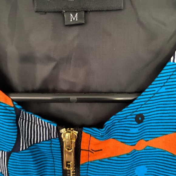 Vibrant Blue and Orange Trench Coat with Geometric Design - Picture 3 of 4